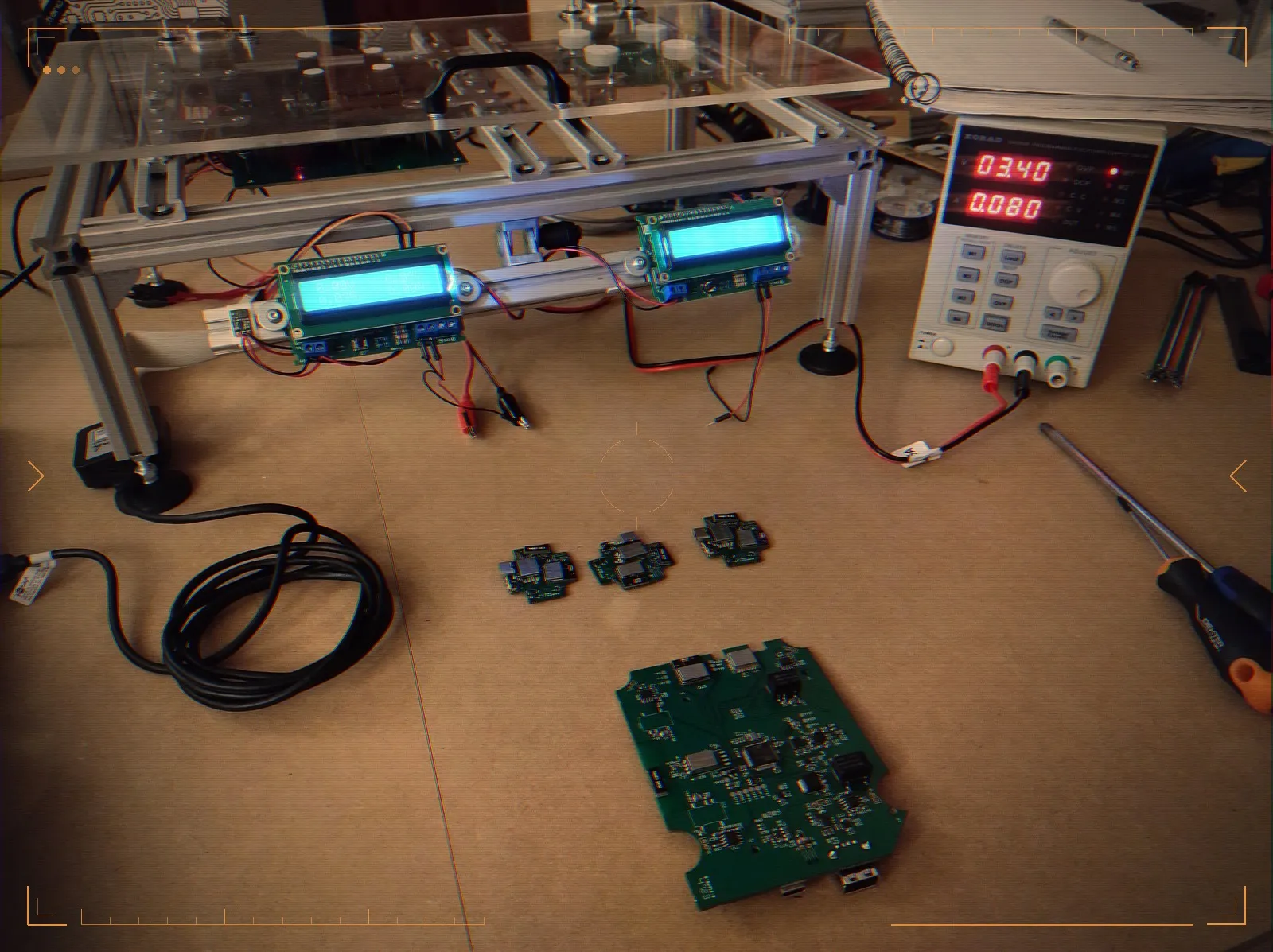 The jig with its readouts, a board under test in front